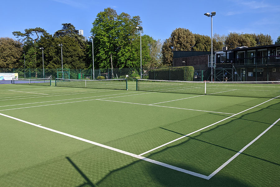 Astro turf tennis courts in summer.