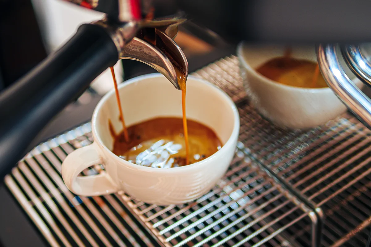 Espresso Machine Coffee Espresso being poured from our coffee machine.