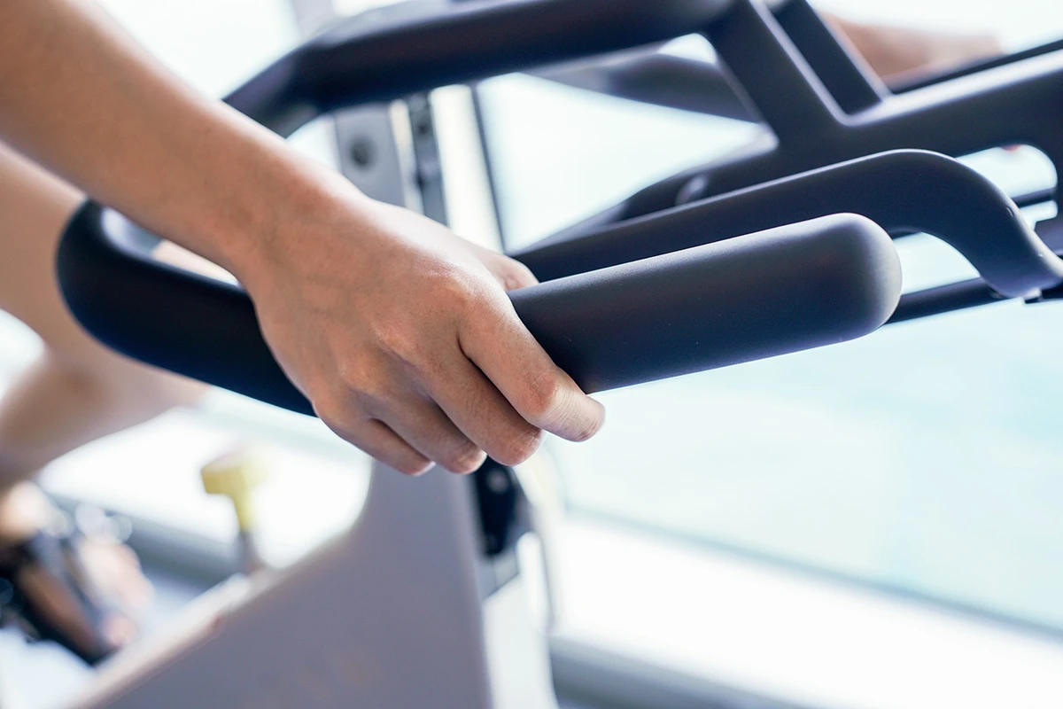 Woman on exercise bike in the gym.