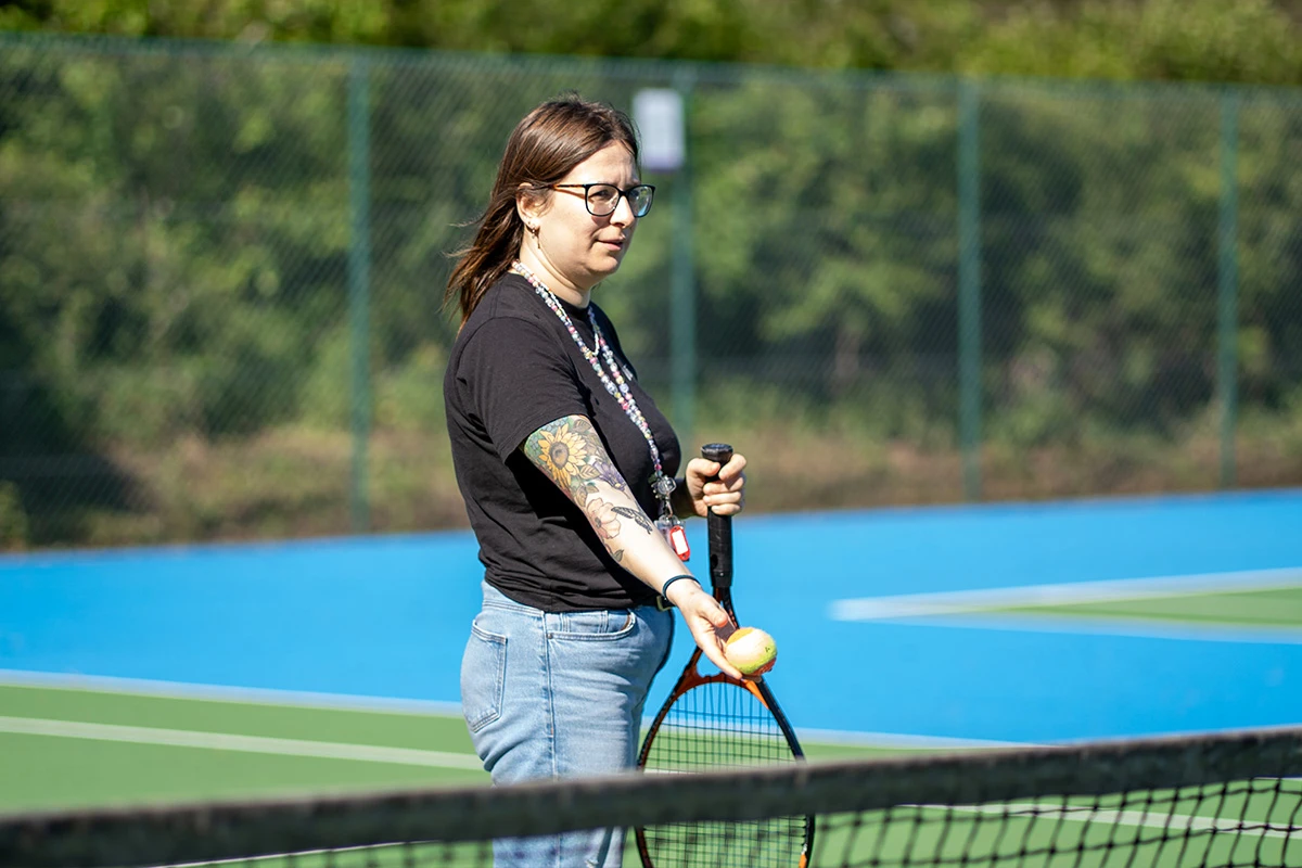 pay-to-play-tennis-adult-playing-tennis